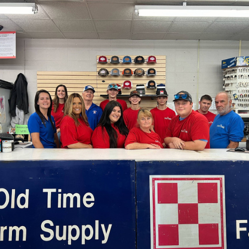 Old Time Farm Supply, Inc. staff inside the store behind the counter