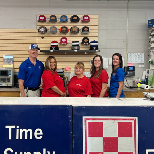 Old Time Farm Supply, Inc. staff inside the store behind the counter