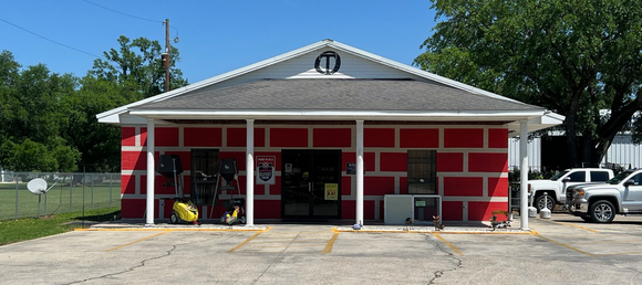 Old Time Farm Supply, Inc. store front on a clear day.